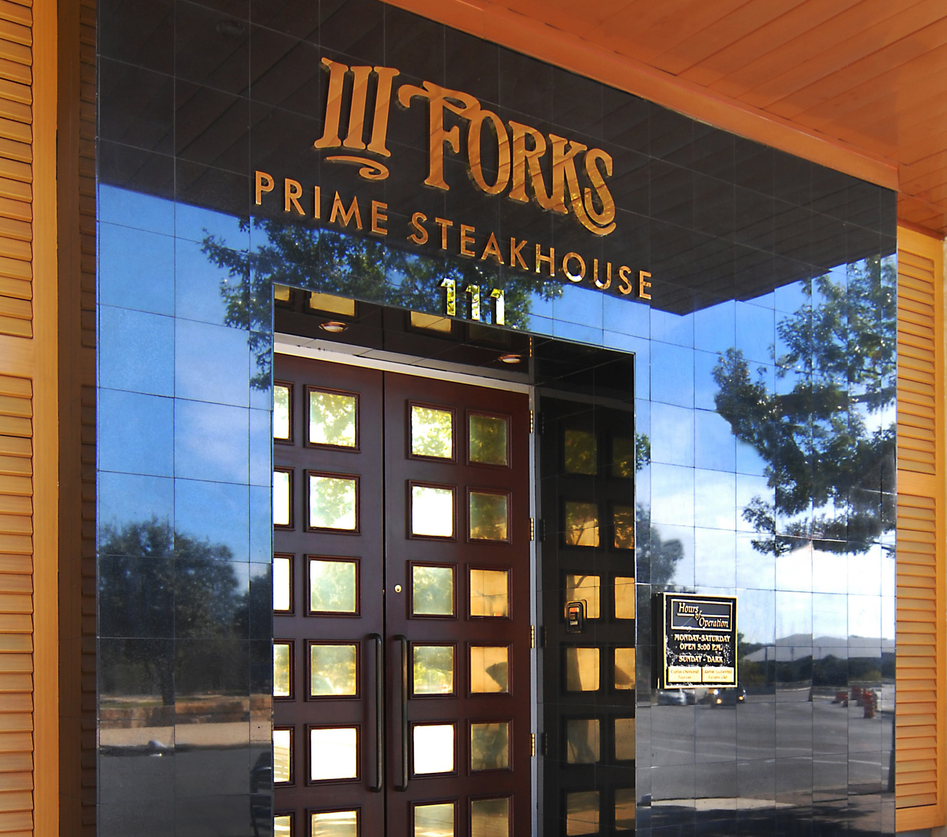 Iiif austin exterior doorl min iii forks restaurant